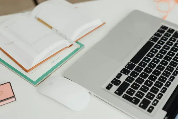 A laptop and desk calendar arranged as part of a quit date planning session